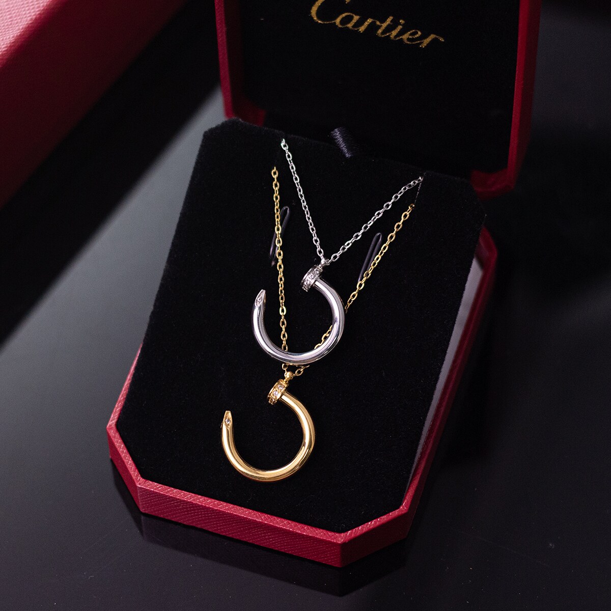 Silver tone and gold tone pendants shown together