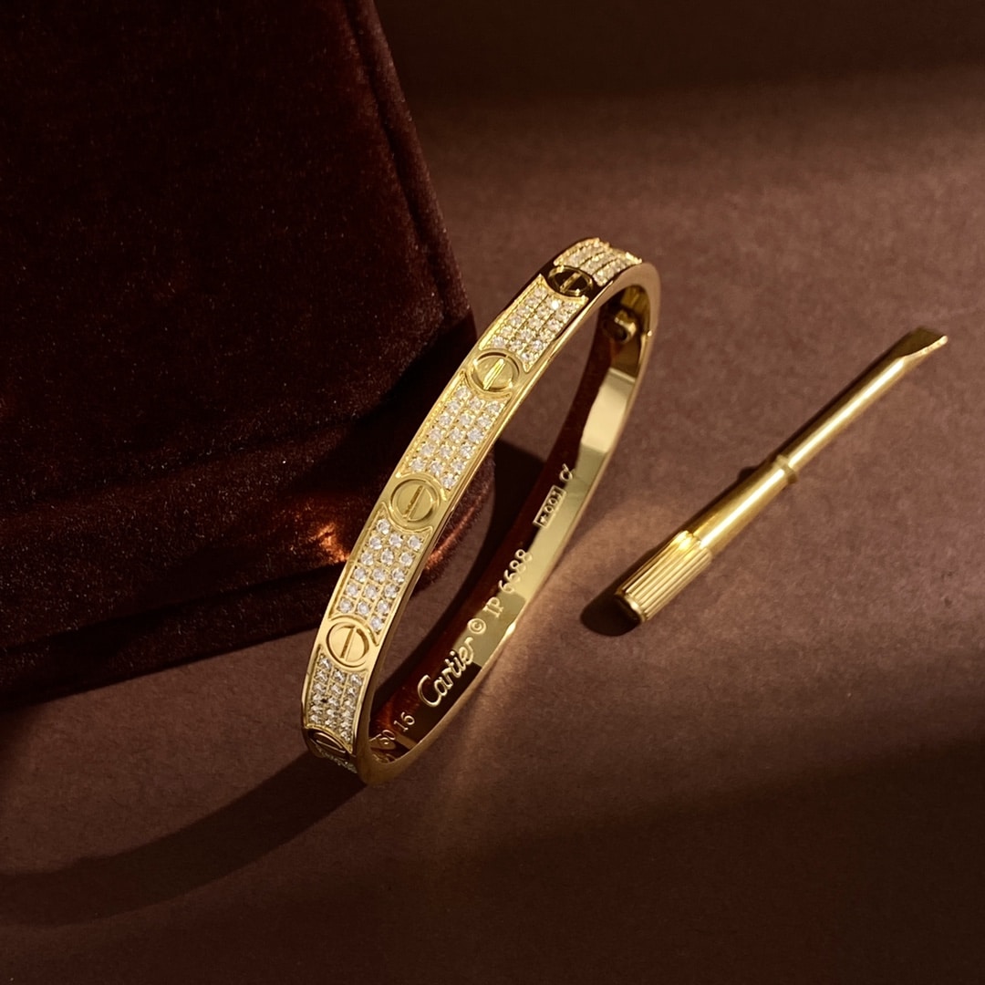 Yellow gold Love Pavé bangle with pavé-set stones and screw motif detailing