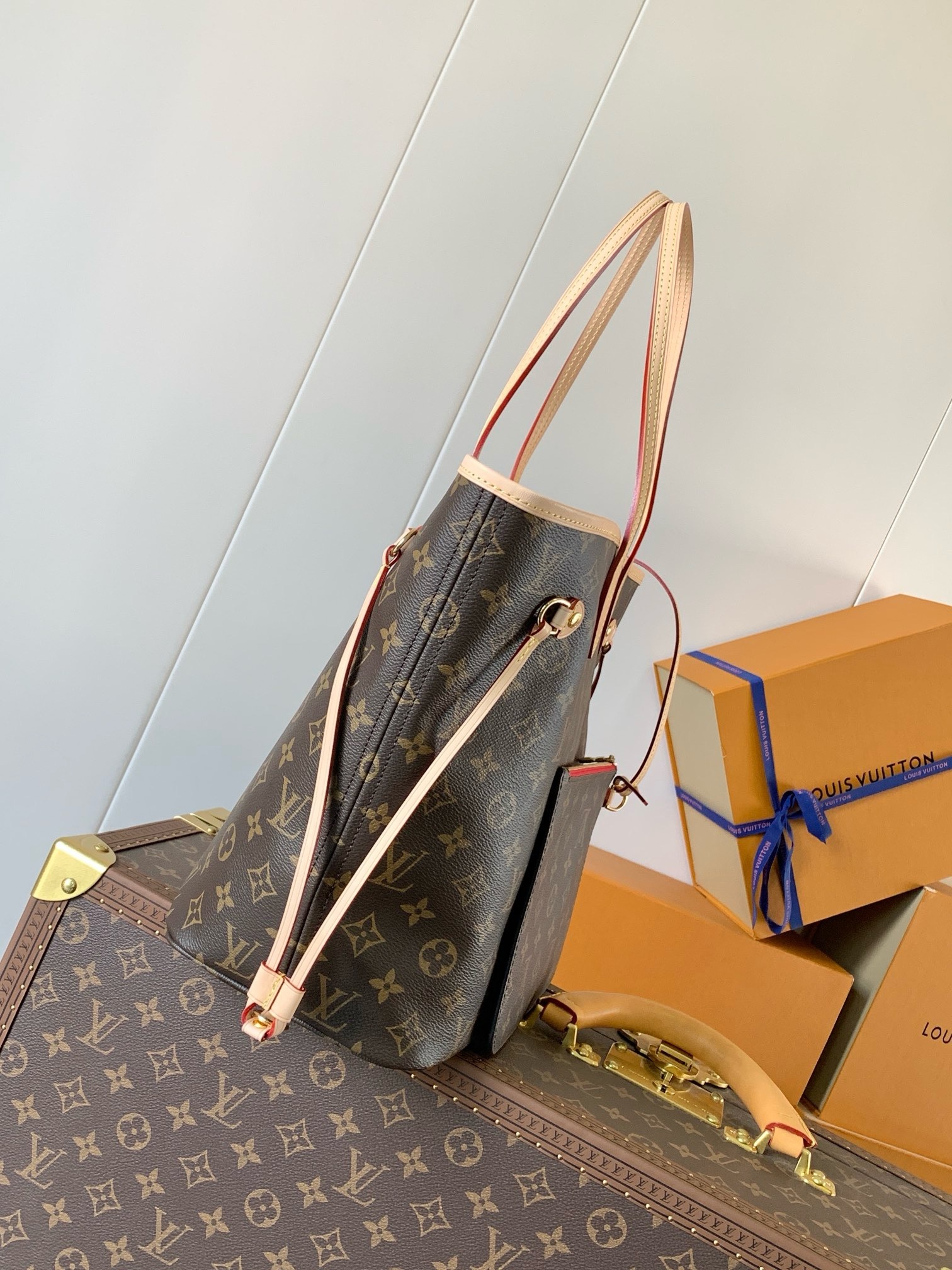 Side profile of the tote showing the adjustable side lace and gathered silhouette